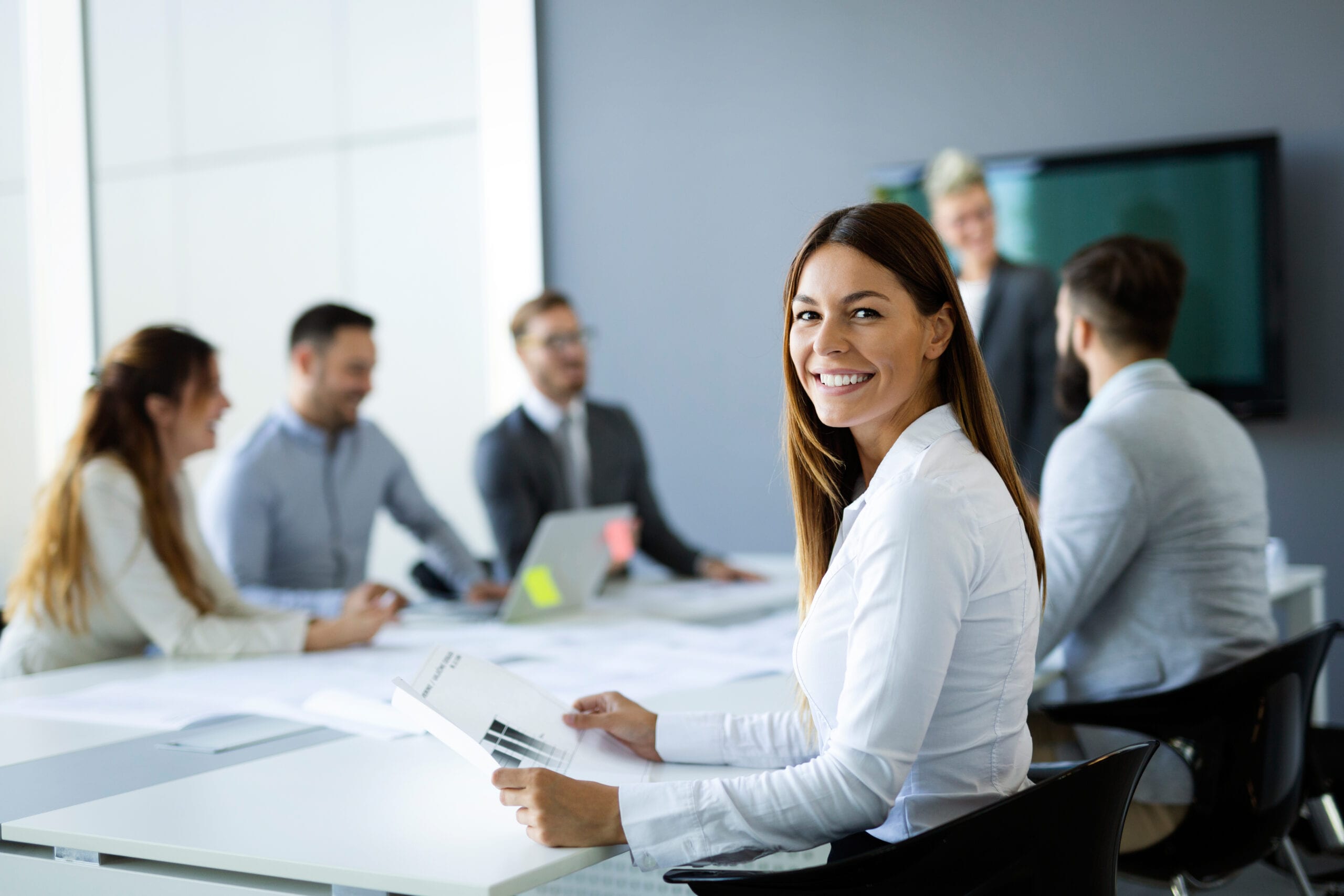 Image of businesswoman, smiling during conference meeting