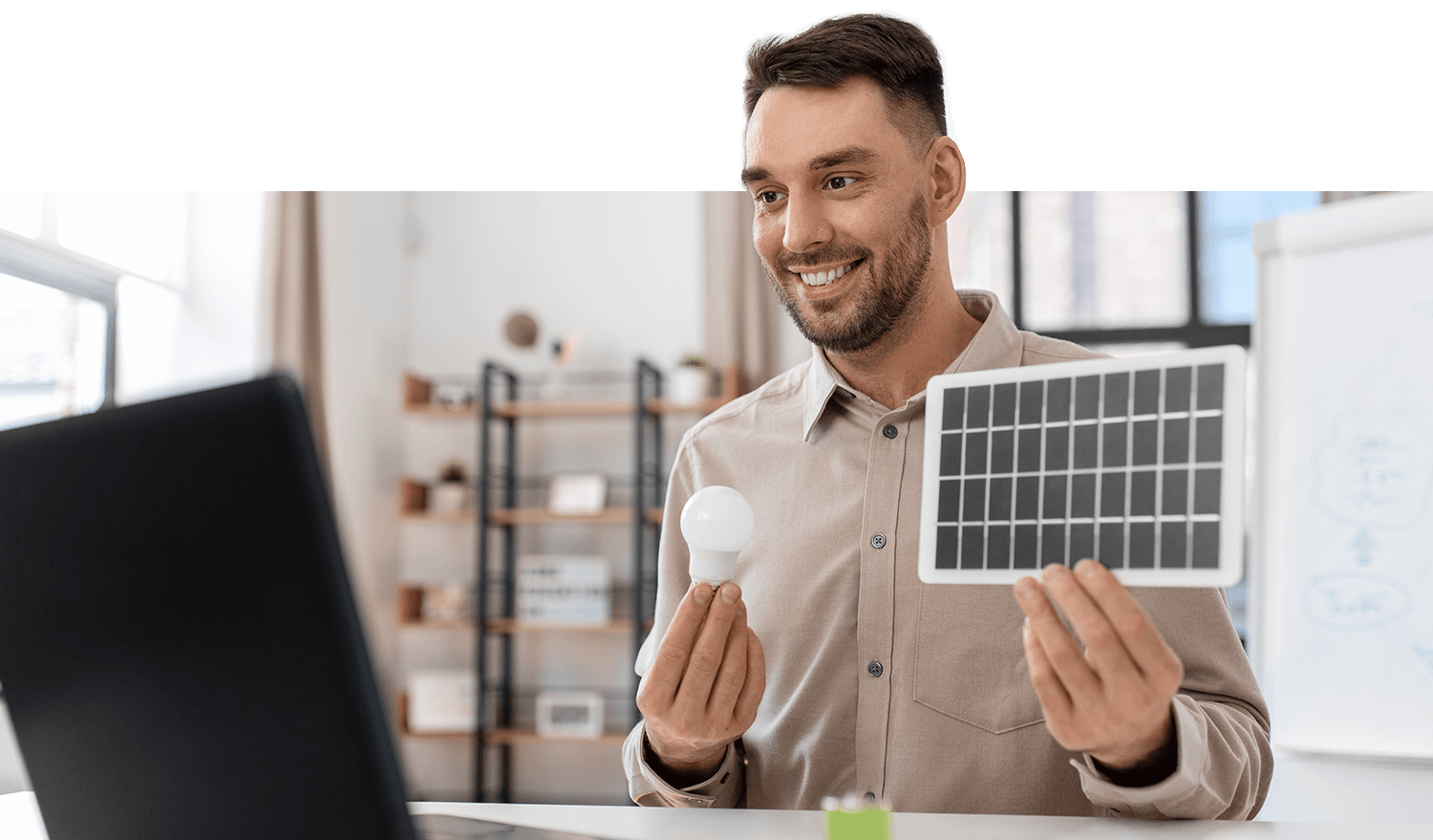 Image of energy solutions specialist explaining solar panel and energy, efficient lightbulbs