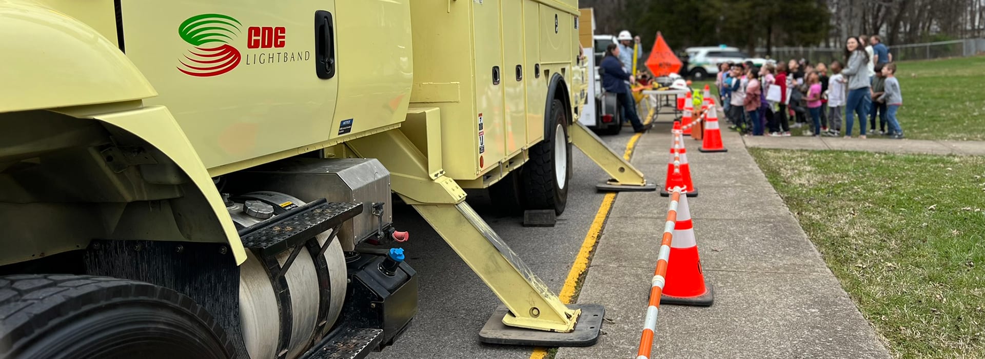 Image of CDE Lightband electrical truck parked outside of school for an educational demonstration