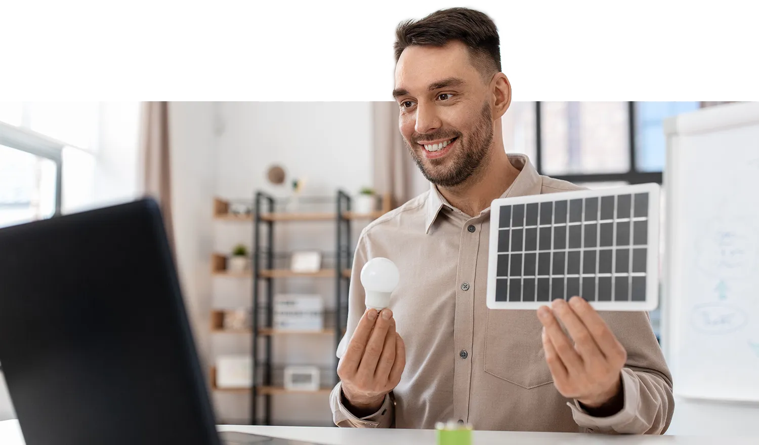 Image of energy solutions specialist explaining solar panel and energy, efficient lightbulbs