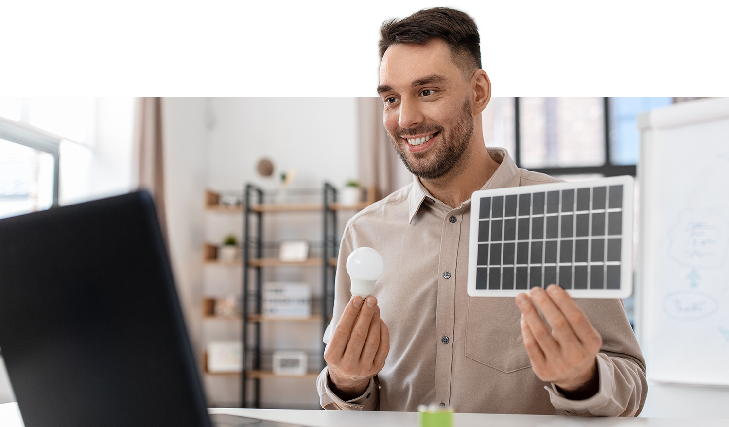 Image of energy solutions specialist explaining solar panel and energy, efficient lightbulbs